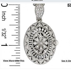 Diamond vintage style oval locket in sterling silver.